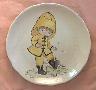 Boy in mud puddle, round plate
